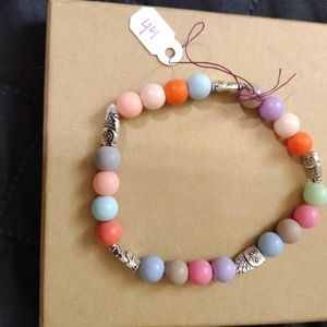 Artemis's Gems custom-made beaded bracelet with metal owl charms, rainbow